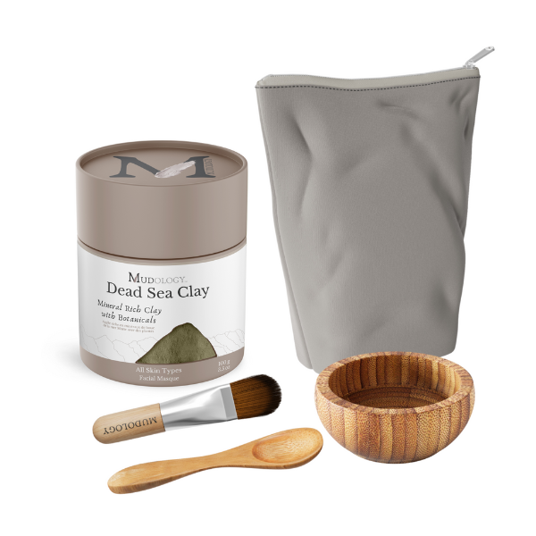 Dead Sea Clay product set with a tin, brush, spoon, bowl, and pouch