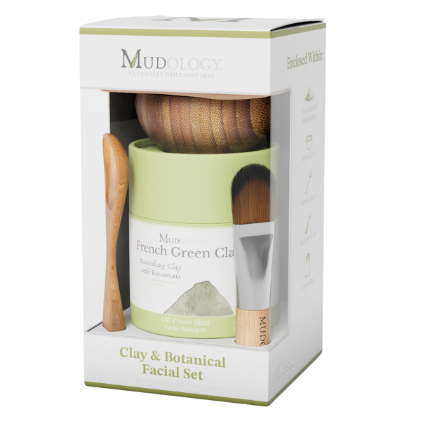 Mudology facial set packaging with green jar, brush, and tools