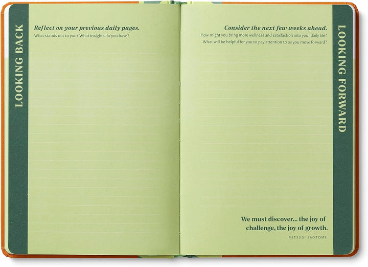 Open notebook with prompts on each page, titled 'Looking Back' and 'Looking Forward'.