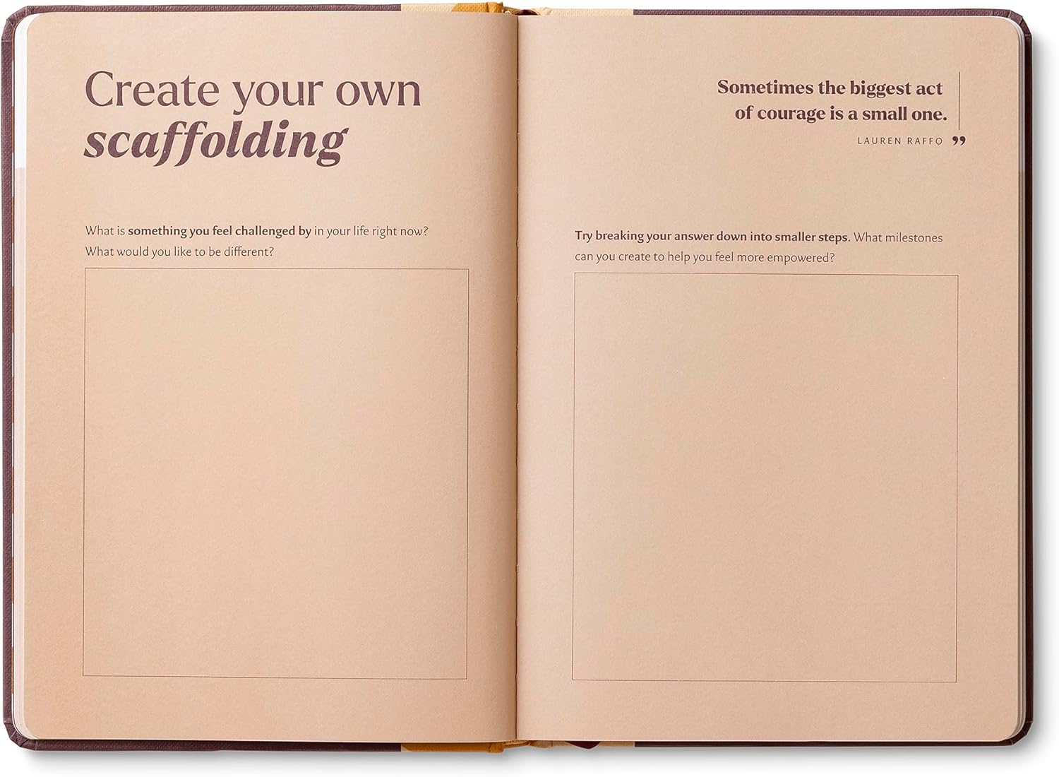 Open notebook with text prompts on beige pages