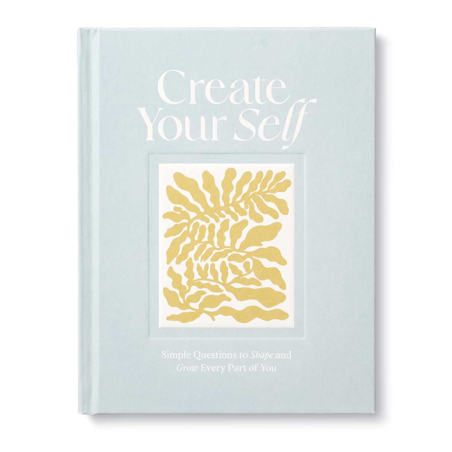 Book titled 'Create Your Self' with gold abstract design