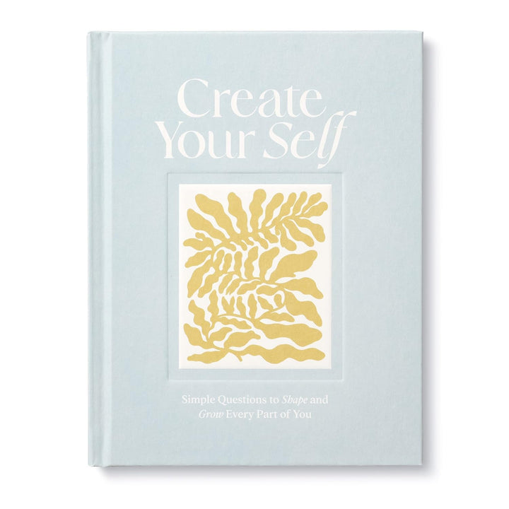 Book titled 'Create Your Self' with gold abstract design