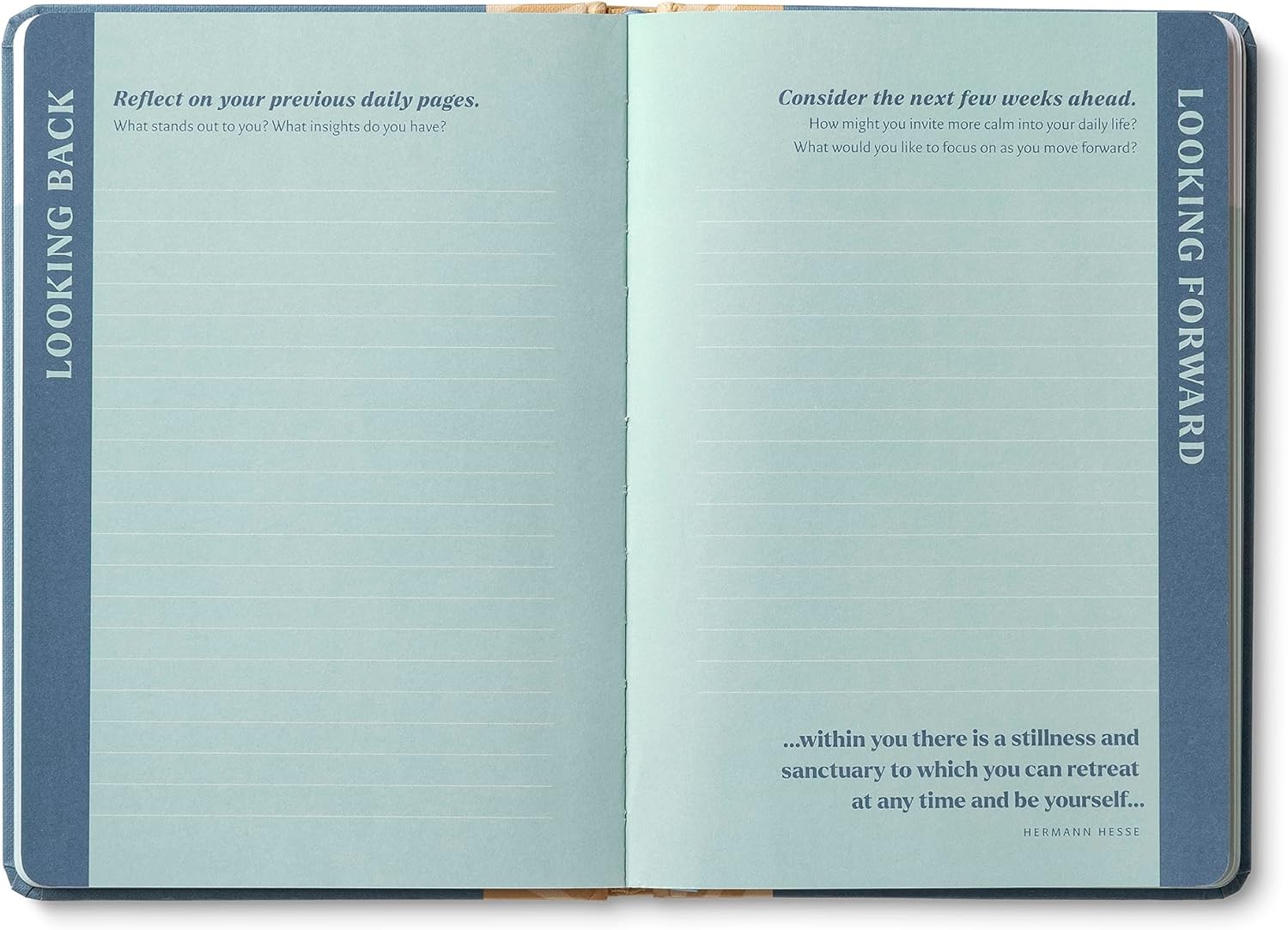 Open notebook with reflective prompts on each page