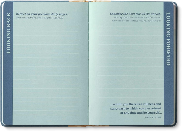 Open notebook with reflective prompts on each page