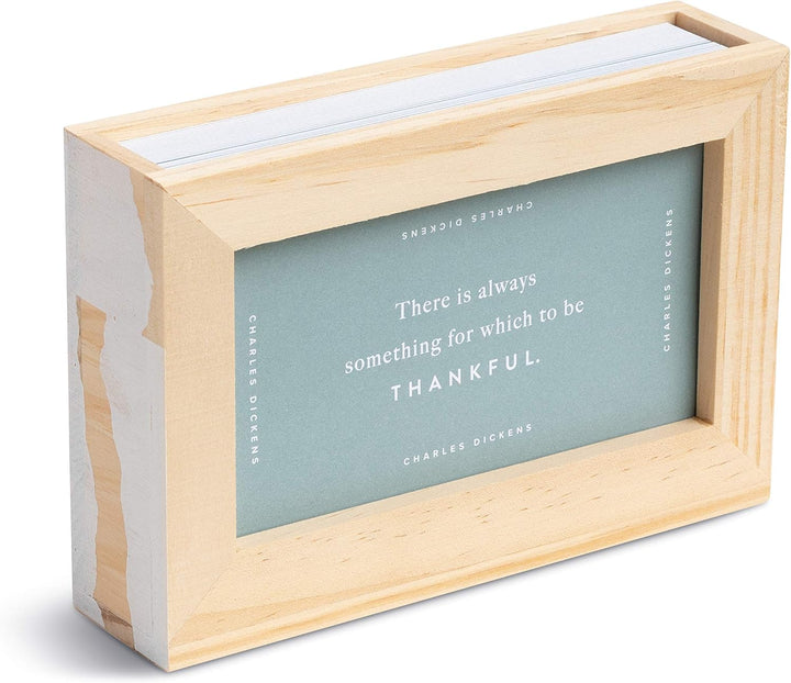 Wooden box with a quote by Charles Dickens