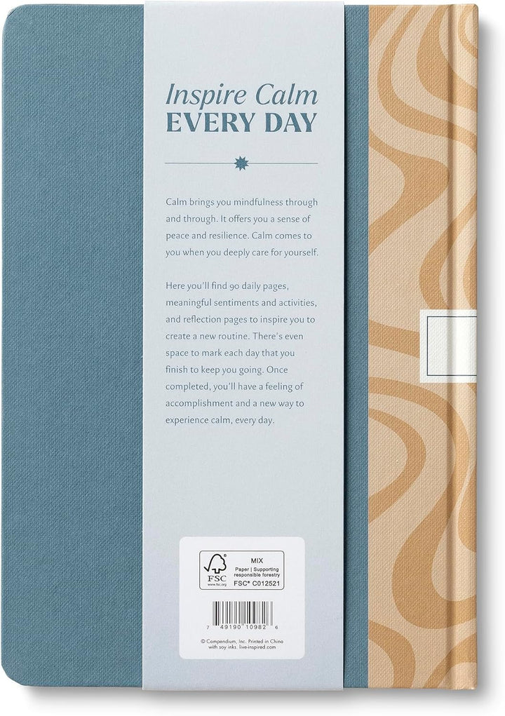 Notebook with blue cover and beige patterned side, featuring text 'Inspire Calm Every Day'.