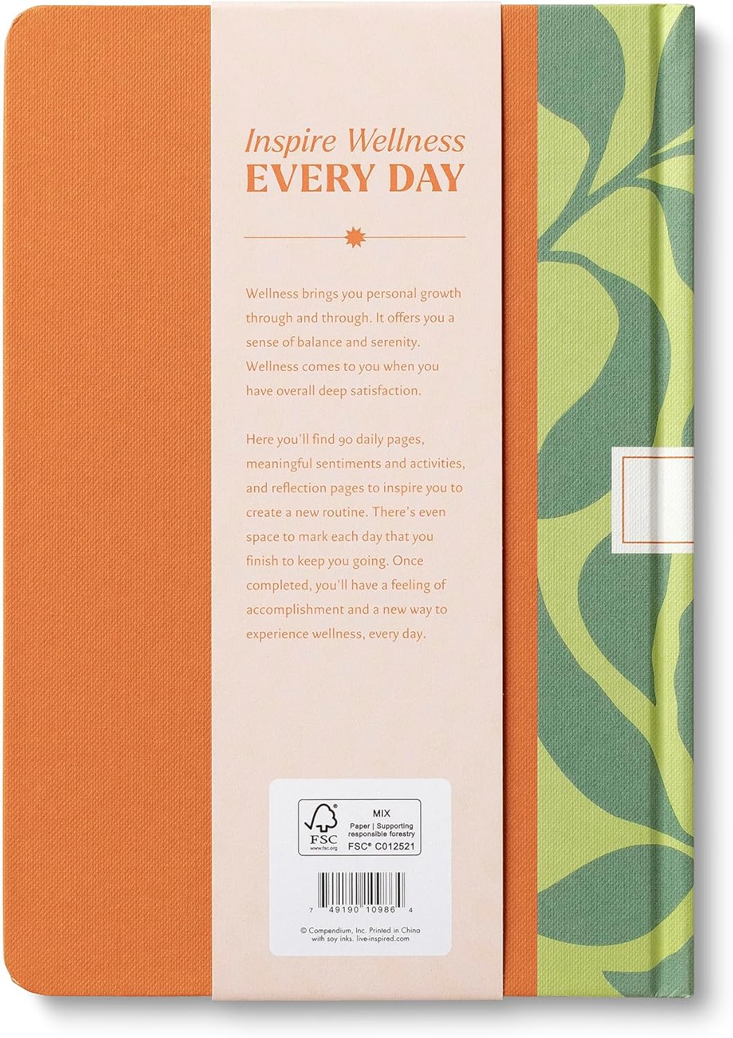 Two notebooks with different covers, one orange and one with green leaf pattern