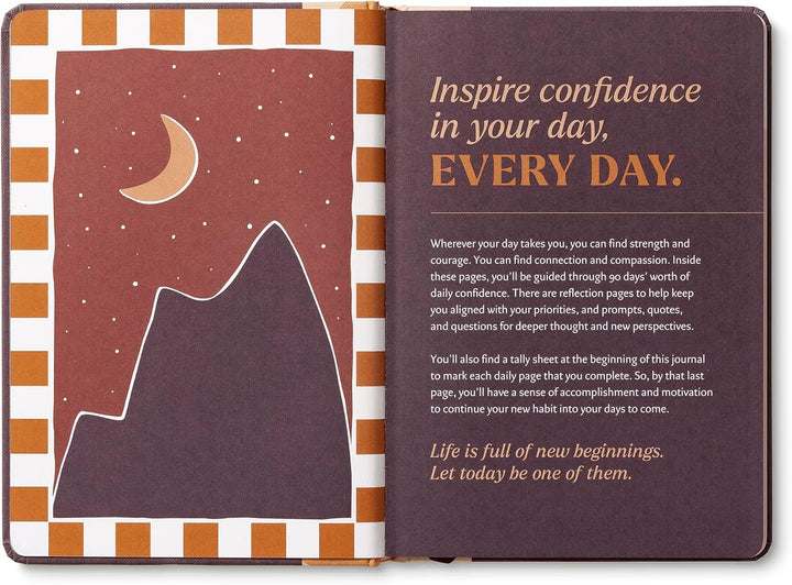 Open journal with mountain illustration and motivational text
