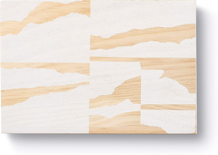 Wooden cutting board with white abstract patterns