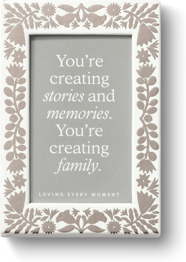 Decorative photo frame with floral patterns and a motivational quote