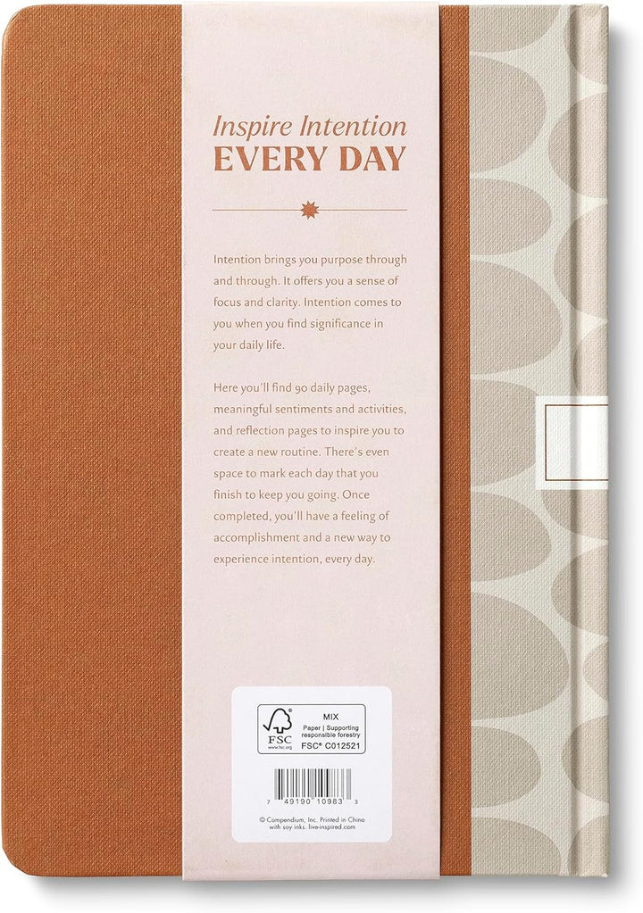 Notebook with a brown cover and patterned spine, featuring text