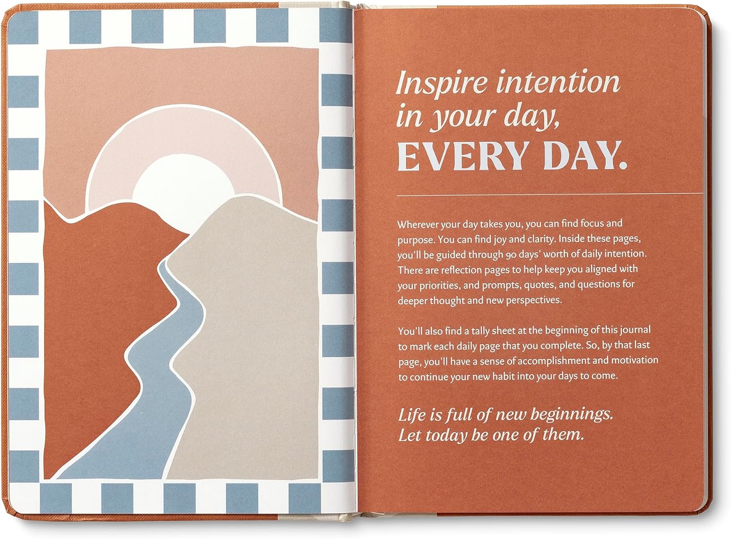 Open journal with motivational text and abstract design