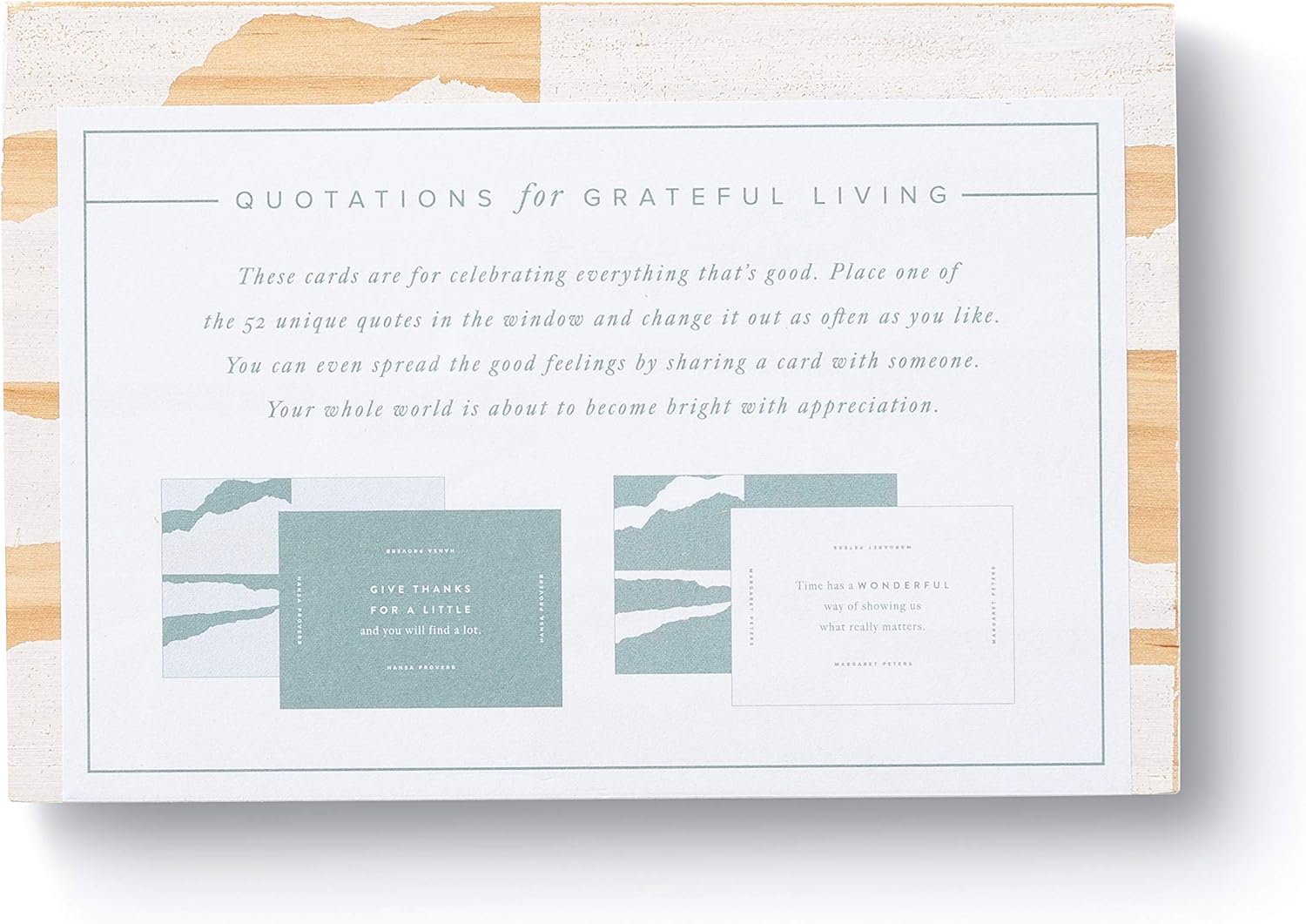 Packaging of 'Quotations for Grateful Living' cards with text and mountain illustrations.