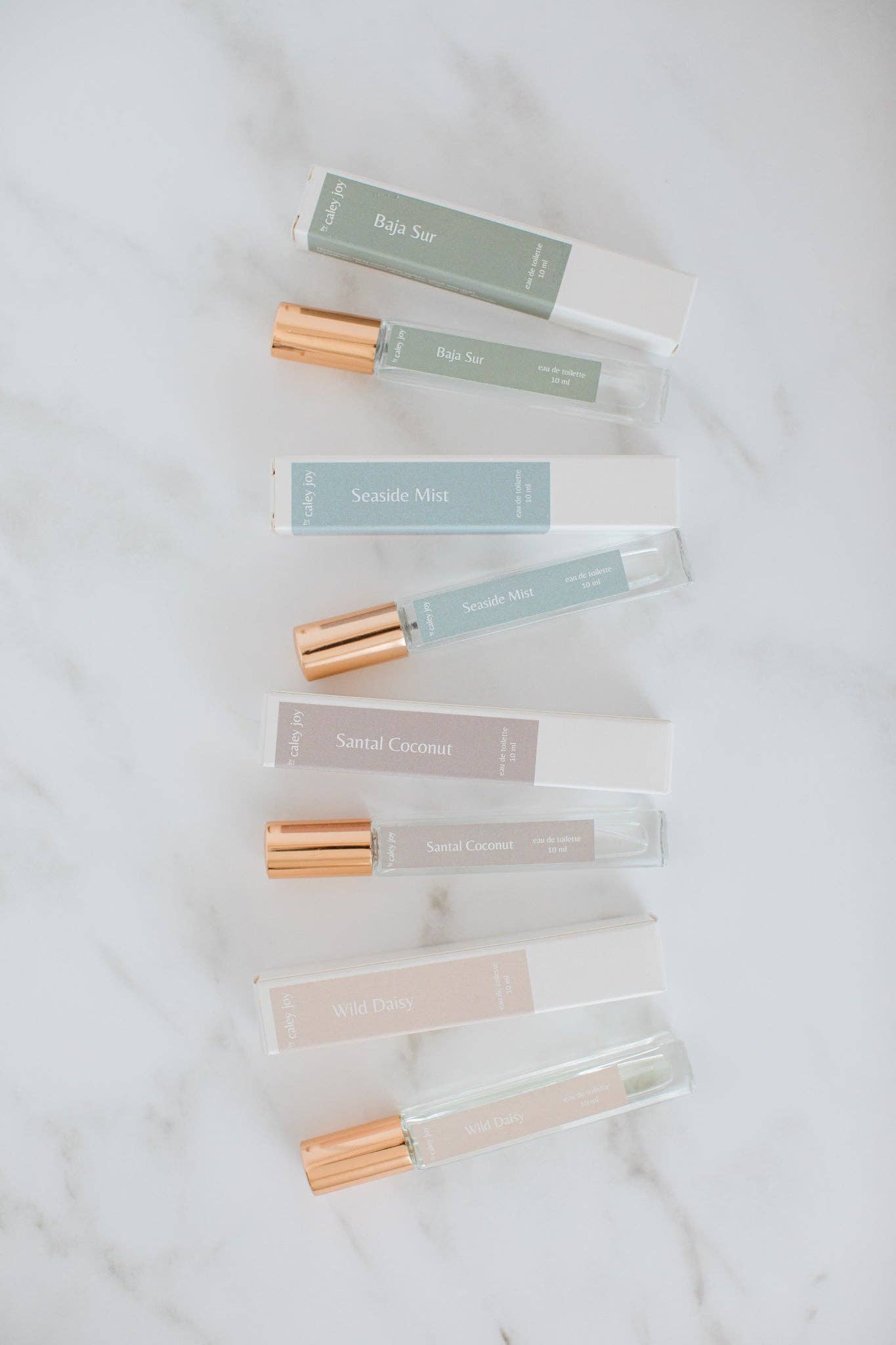 Set of small glass bottles with gold caps