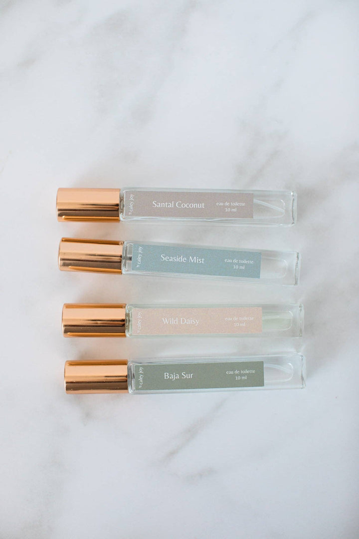 Four perfume bottles with rose gold caps