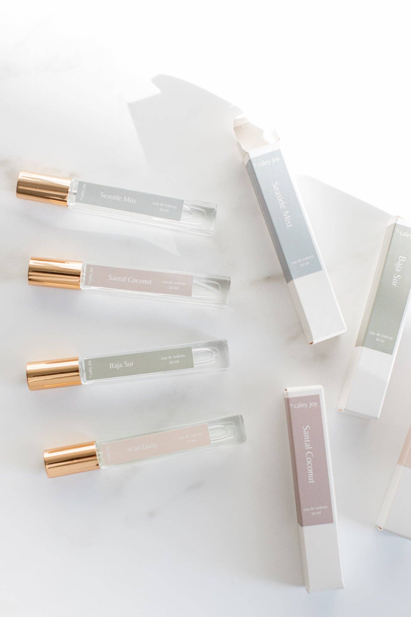 Set of small cylindrical containers with gold caps