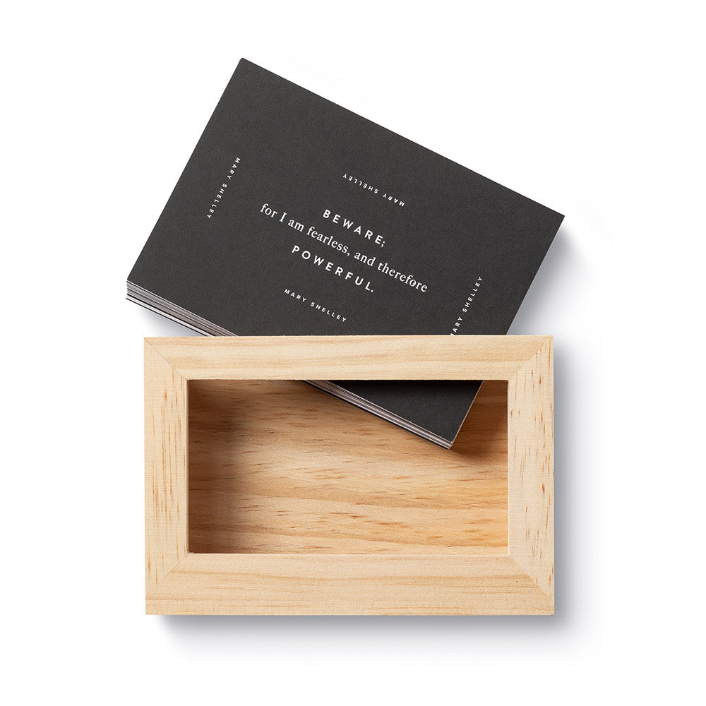 Wooden box with a black book inside