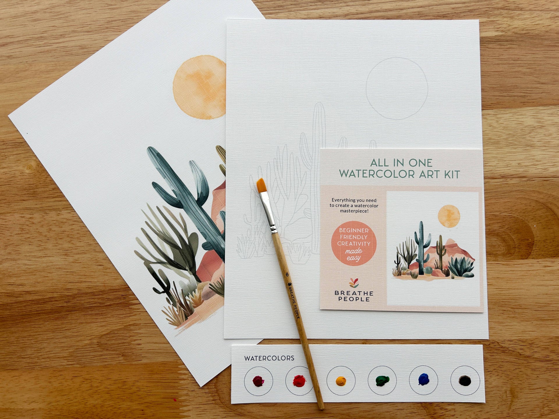 Watercolor art kit with paintbrush and printed materials