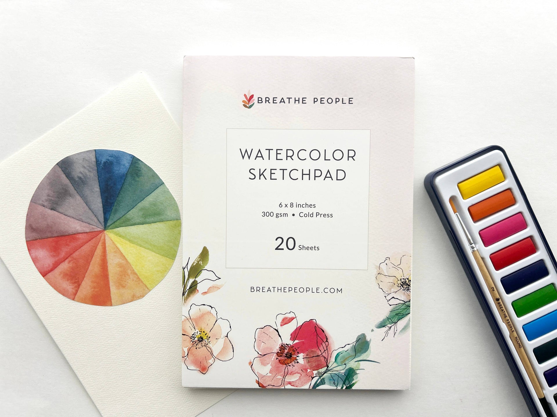 Watercolor sketchpad with color wheel and paint set