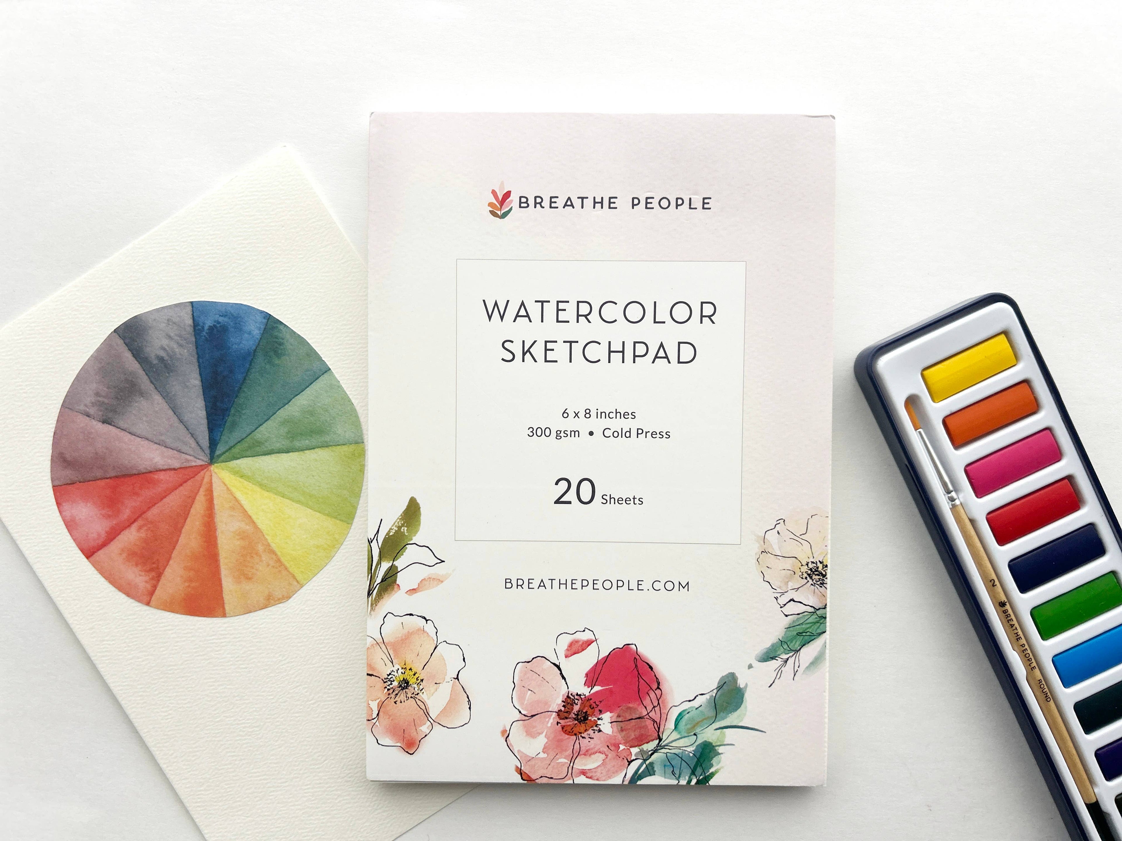 Watercolor sketchpad with color wheel and paint set