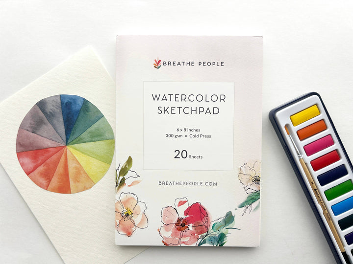 Watercolor sketchpad with color wheel and paint set