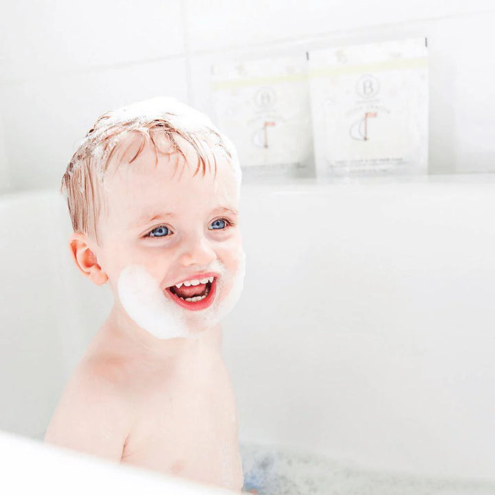 Child in a bathtub with bubbles