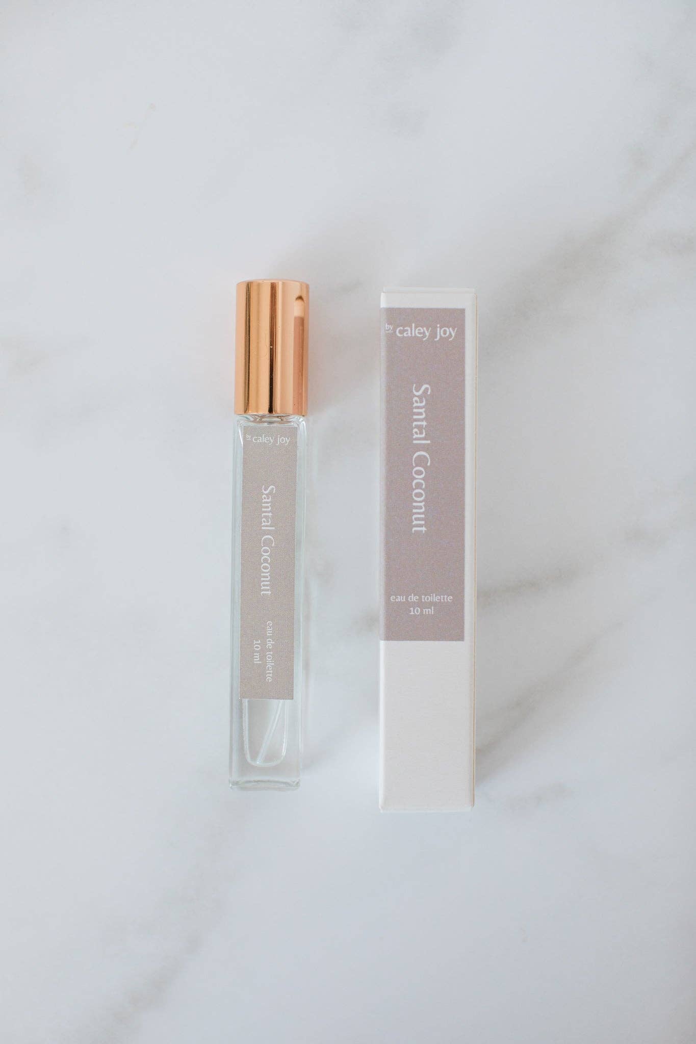 Perfume bottle with gold cap and packaging