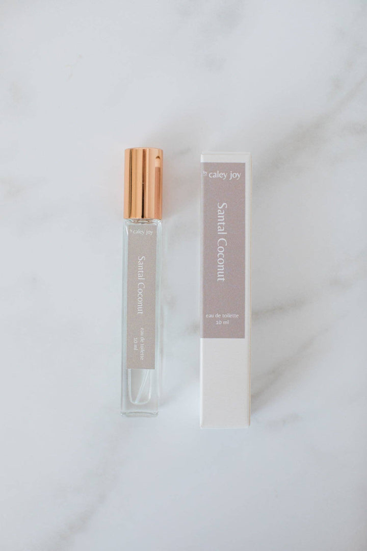 Perfume bottle with gold cap and packaging