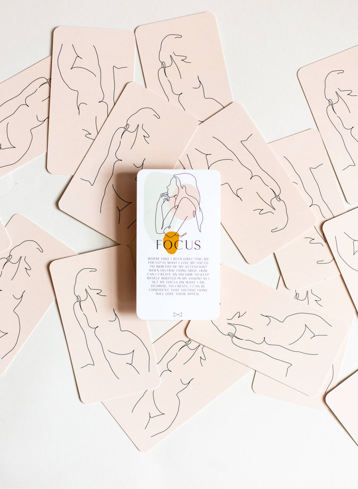 Card game box labeled 'Focus' surrounded by cards with line art